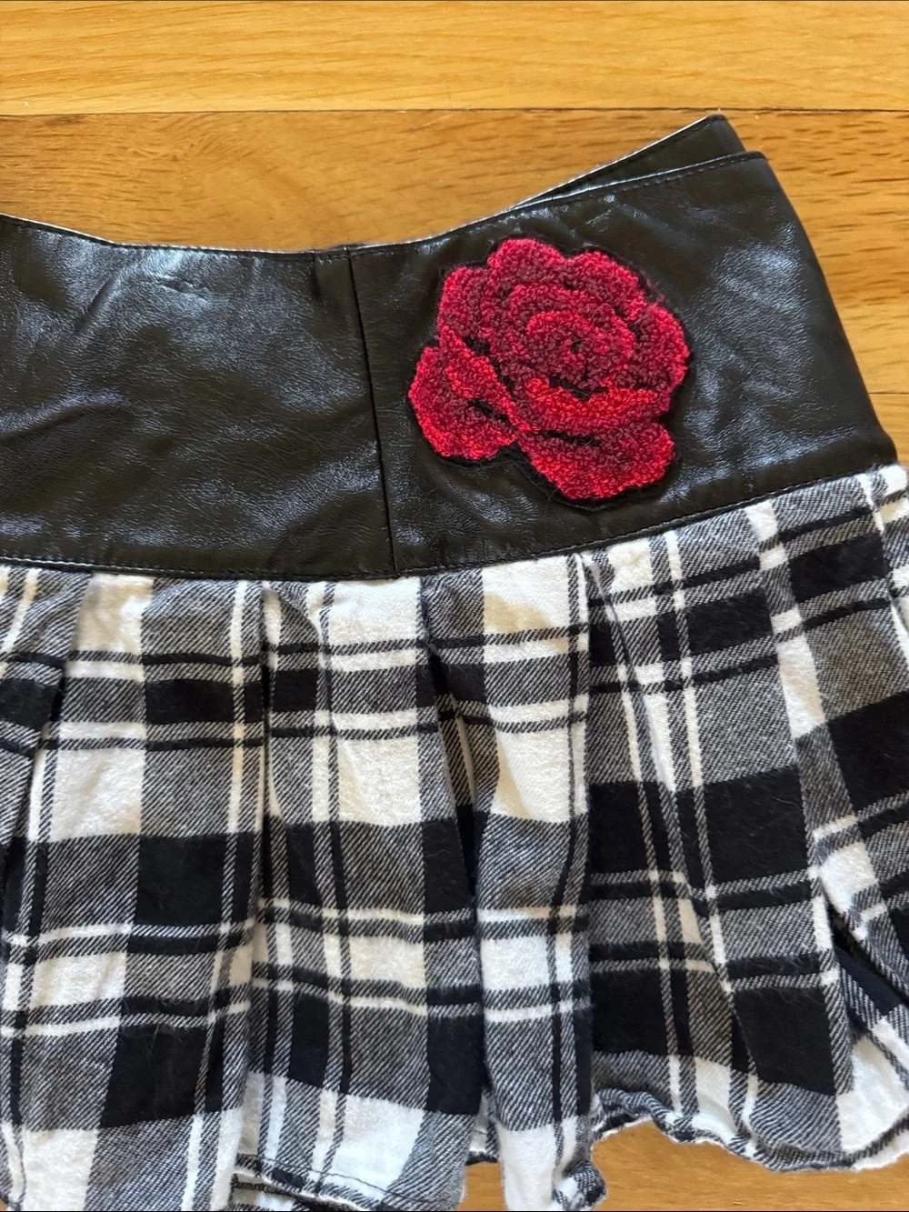 Kate Mack Black Faux Leather Skirt with Red Rose Accent